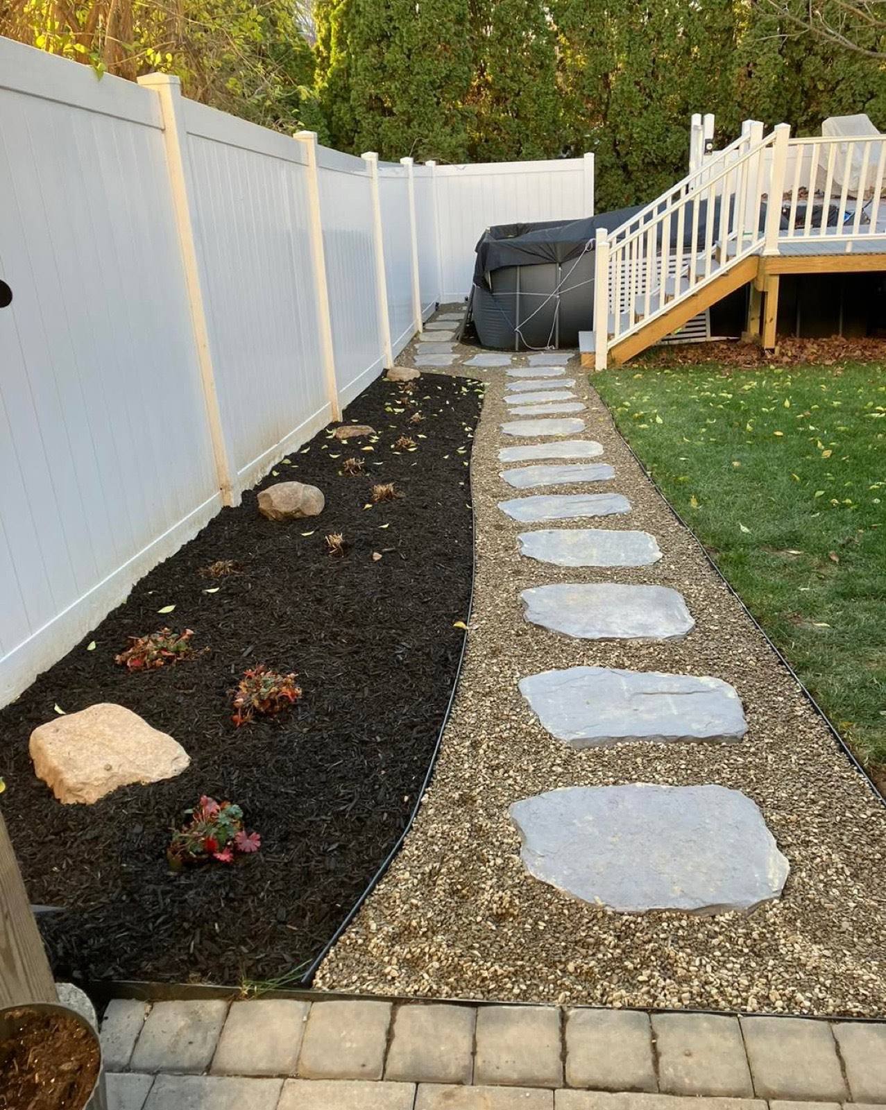 Stepping-stone path with fresh planting bed